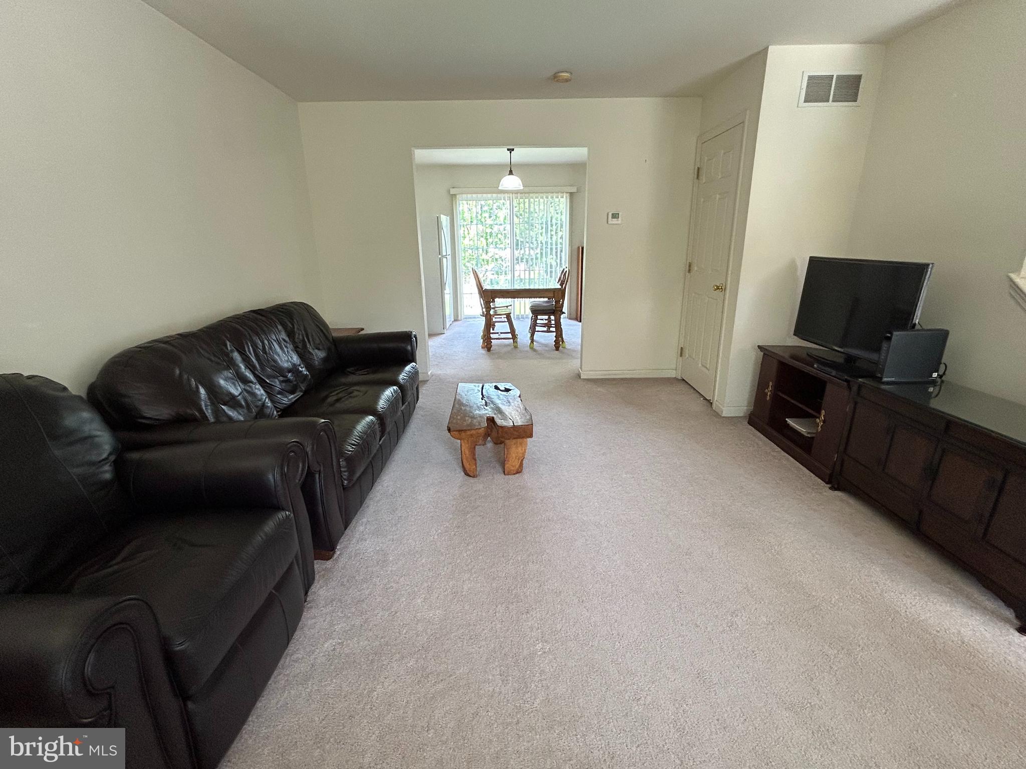 349 Oneida Drive Sinking Spring, PA 19608 - Photo 11 of 35 a living room with furniture and a flat screen tv