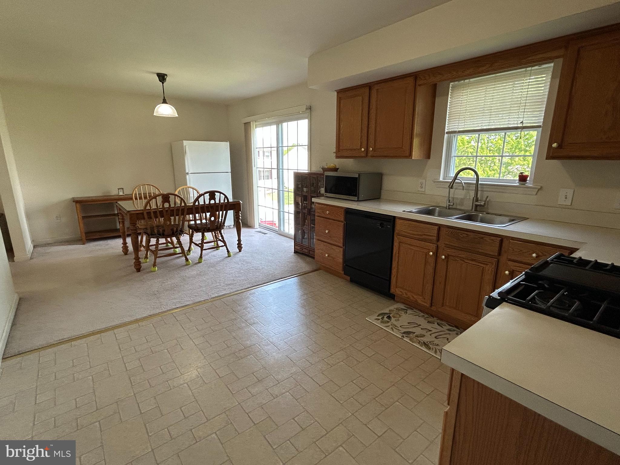 349 Oneida Drive Sinking Spring, PA 19608 - Photo 16 of 35 a kitchen with sink cabinets and window