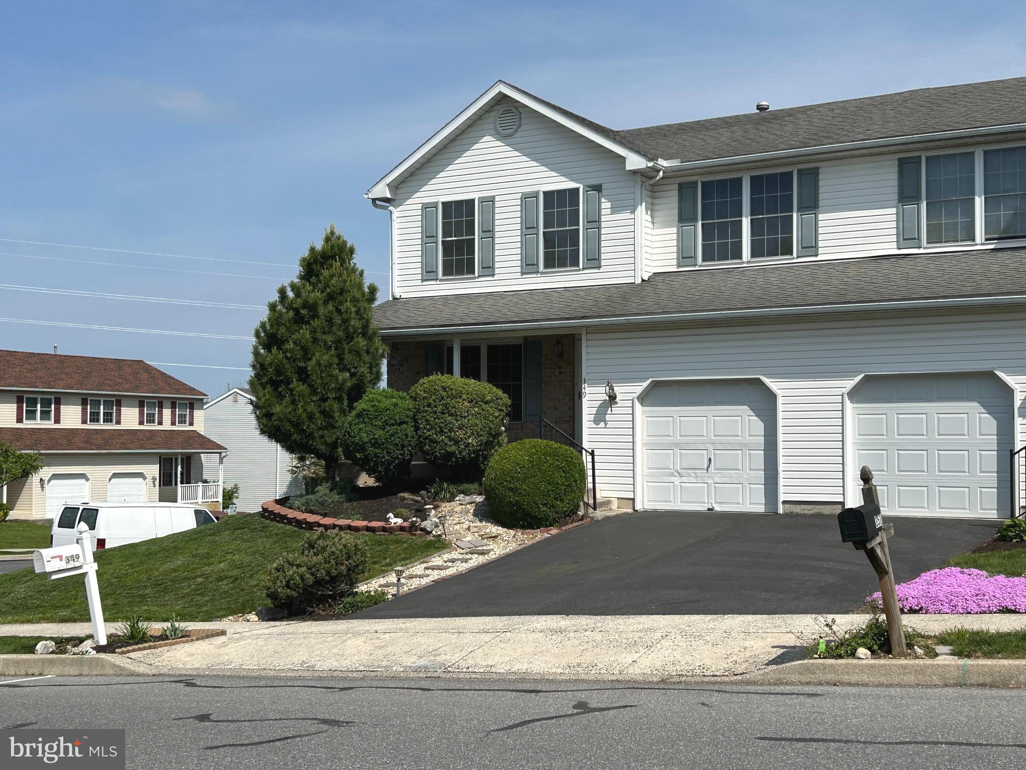 349 Oneida Drive Sinking Spring, PA 19608 - Photo 2 of 35 a front view of a house with garage and parking
