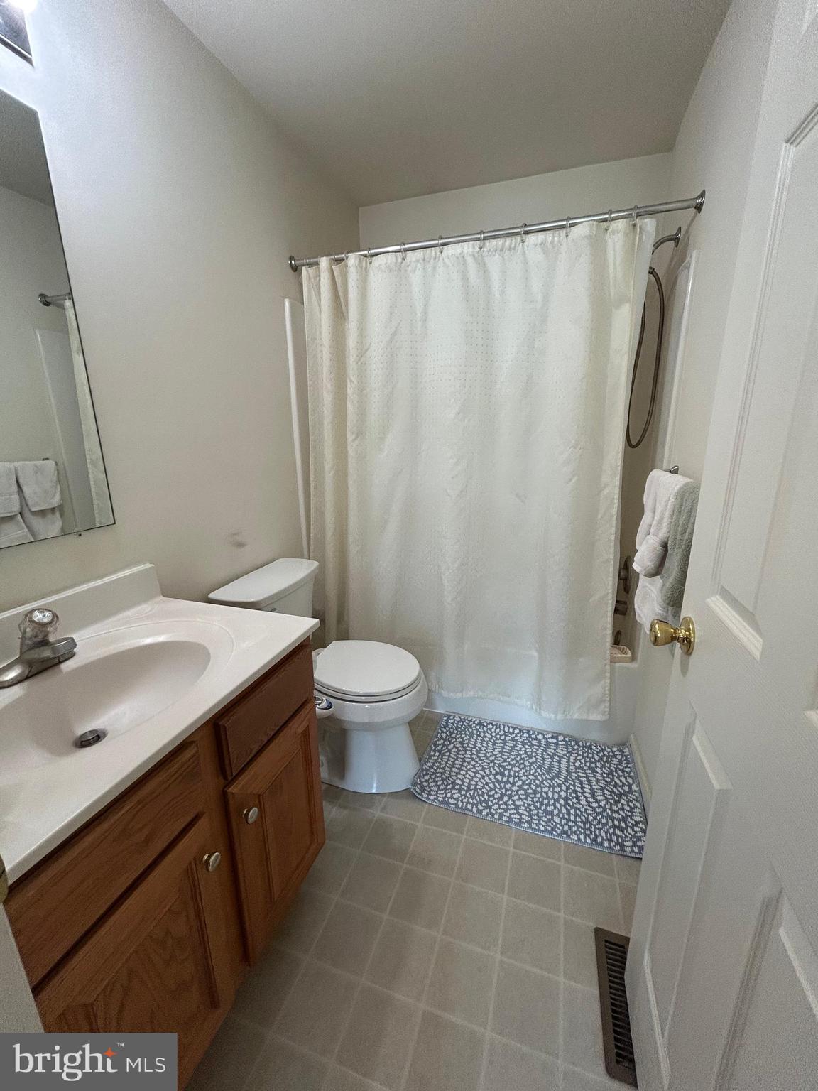 349 Oneida Drive Sinking Spring, PA 19608 - Photo 25 of 35 a bathroom with a sink a toilet a mirror and shower