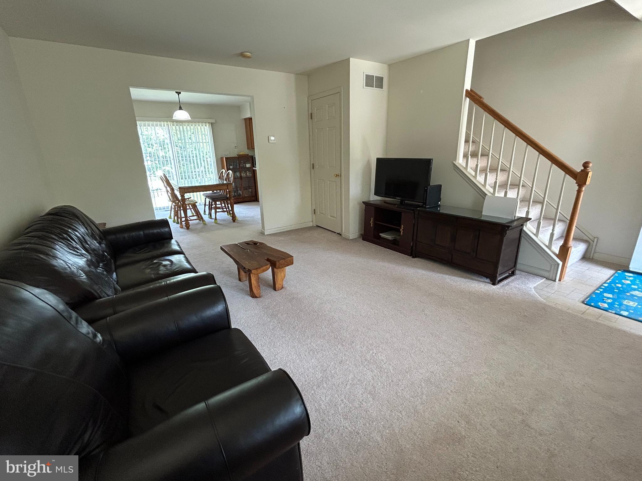 349 Oneida Drive Sinking Spring, PA 19608 - Photo 10 of 35 a living room with furniture and a flat screen tv