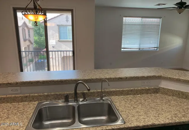 a kitchen with a sink and a window