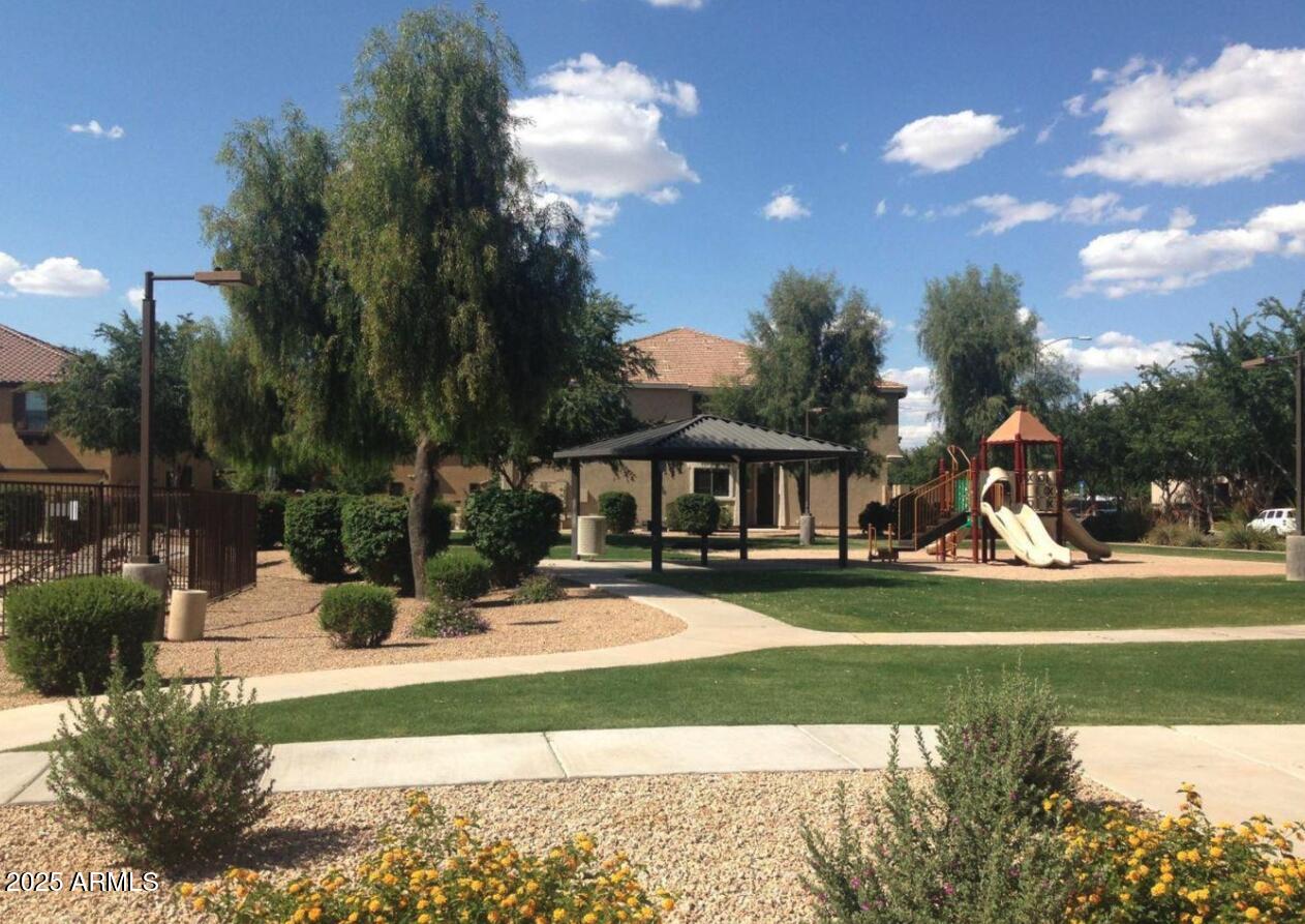 1265 South Aaron, Unit 305 Mesa, AZ 85209 - Photo 25 of 25 a view of a fountain in front of a house