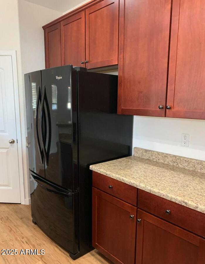 1265 South Aaron, Unit 305 Mesa, AZ 85209 - Photo 9 of 25 a kitchen with metallic refrigerator freezer and a dishwasher