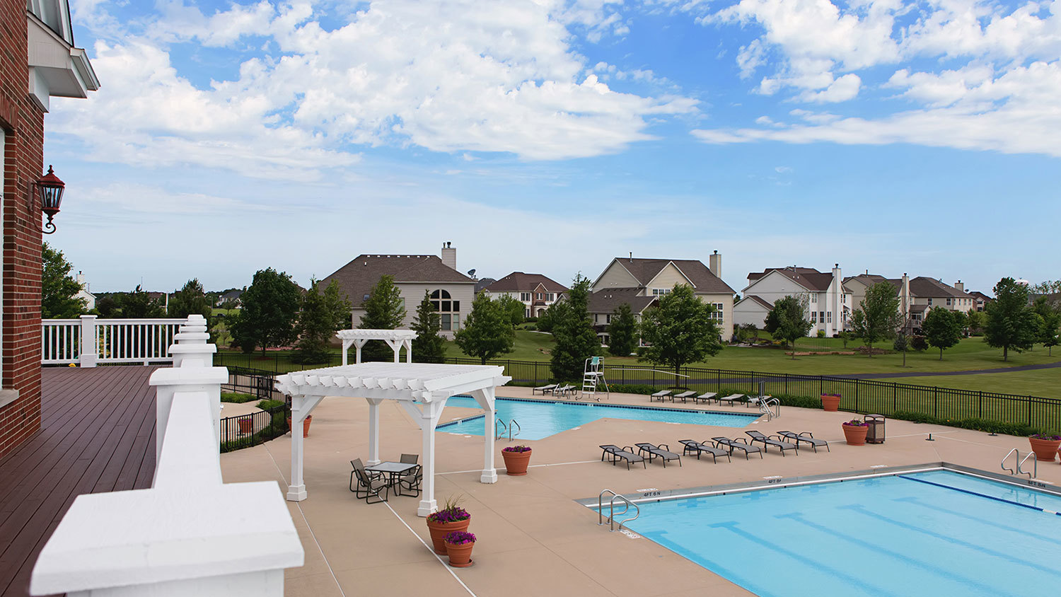 2721 Berrywood Lane Yorkville, IL 60560 - Photo 34 of 38 a view of a swimming pool and trees in the background