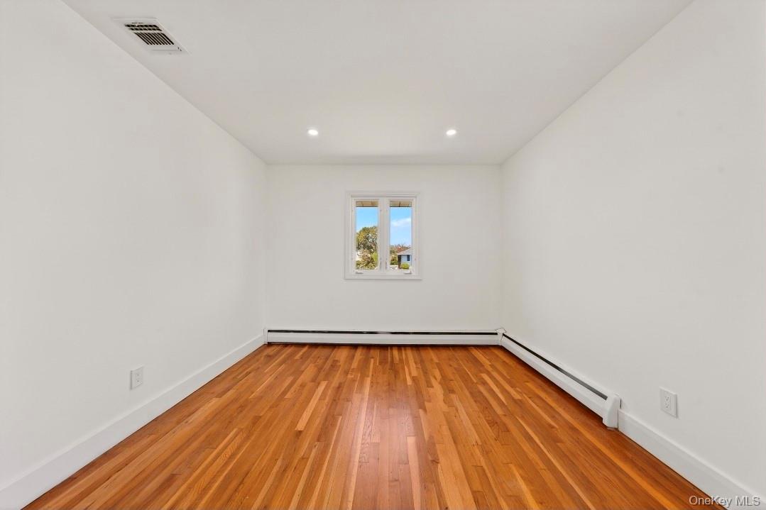 8 White Birch Lane Commack, NY 11725 - Photo 15 of 44 a view of a big room with wooden floor