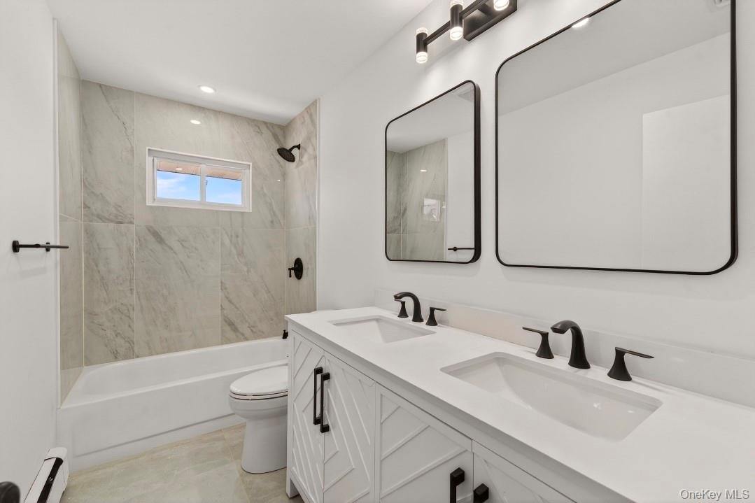 8 White Birch Lane Commack, NY 11725 - Photo 16 of 44 a bathroom with a sink vanity tub and toilet