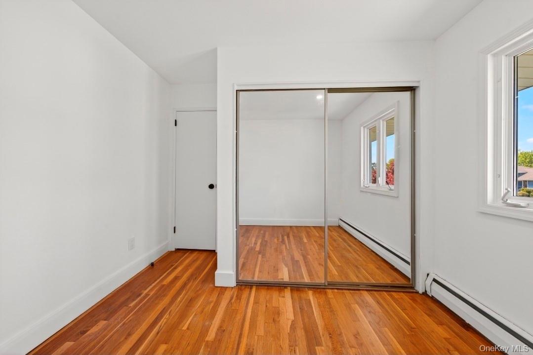 8 White Birch Lane Commack, NY 11725 - Photo 21 of 44 a view of a room with wooden floor closet and a bathroom