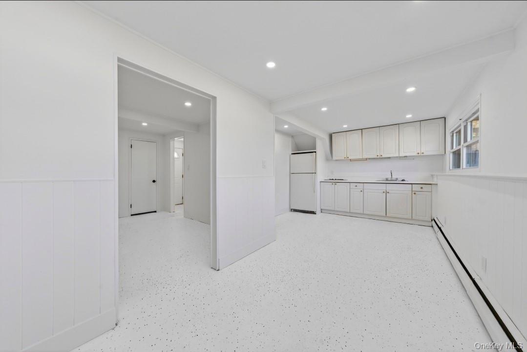 8 White Birch Lane Commack, NY 11725 - Photo 25 of 44 a view of a kitchen with white cabinets