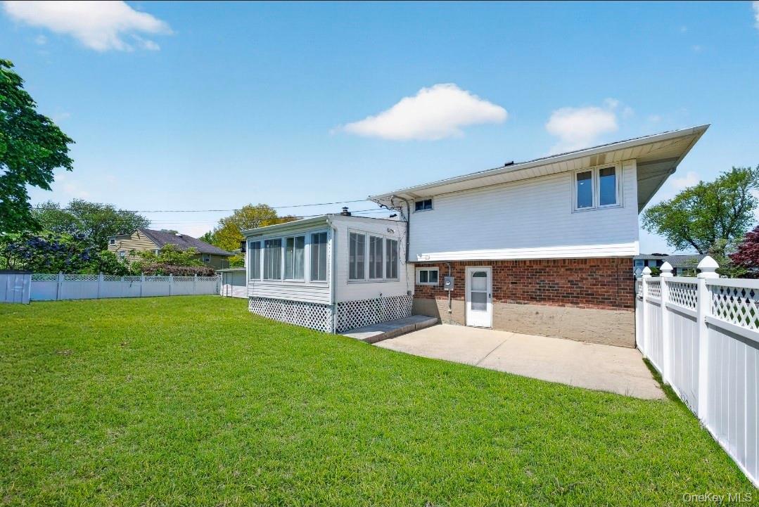 8 White Birch Lane Commack, NY 11725 - Photo 39 of 44 a view of house with backyard and a tub