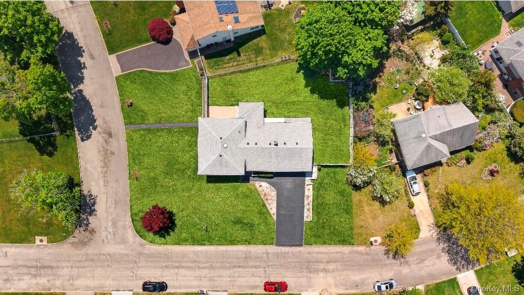 8 White Birch Lane Commack, NY 11725 - Photo 43 of 44 an aerial view of a house with garden space and street view