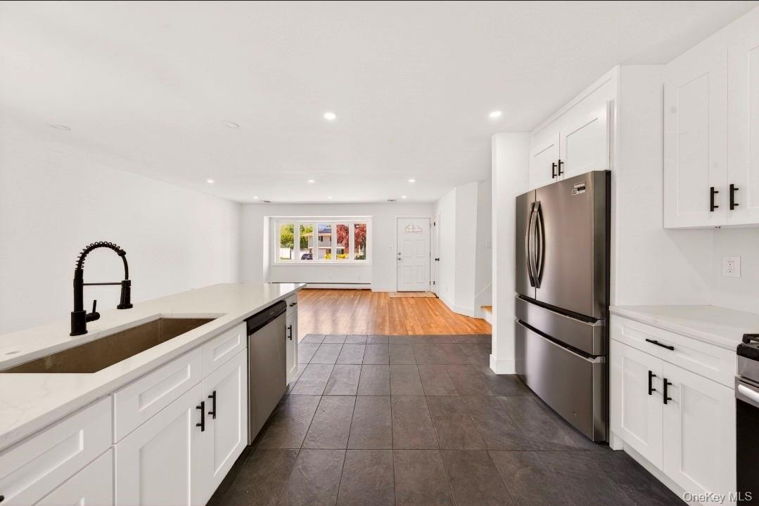 8 White Birch Lane Commack, NY 11725 - Photo 8 of 44 a kitchen with stainless steel appliances granite countertop a refrigerator and a sink