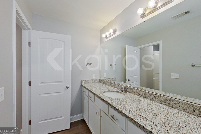 110 Western Red Cedar Drive Springfield, GA 31329 - Photo 14 of 19 a bathroom with a granite countertop sink and a mirror
