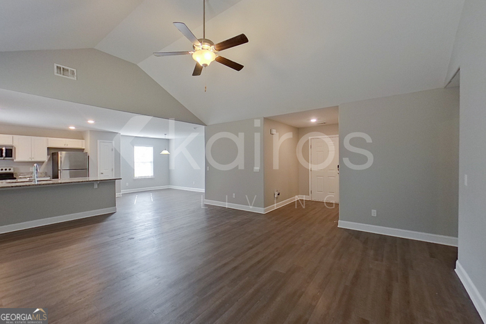 110 Western Red Cedar Drive Springfield, GA 31329 - Photo 2 of 19 a view of an empty room with wooden floor and a window