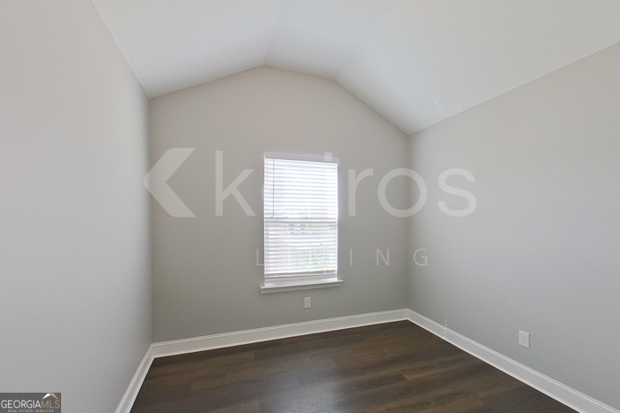 110 Western Red Cedar Drive Springfield, GA 31329 - Photo 10 of 19 an empty room with wooden floor and windows