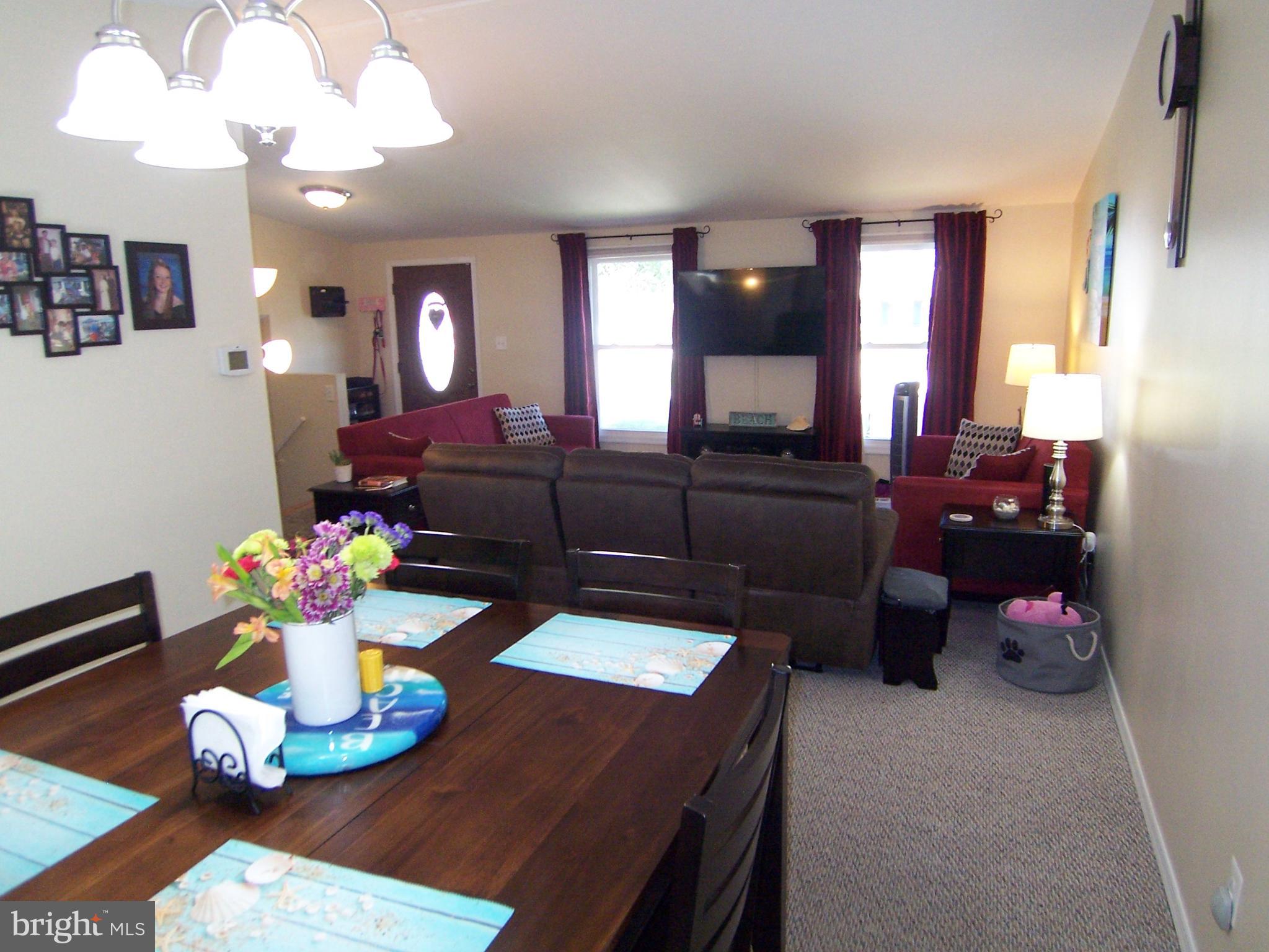 18 Yew Road Baltimore, MD 21221 - Photo 8 of 30 a living room with furniture and chandelier