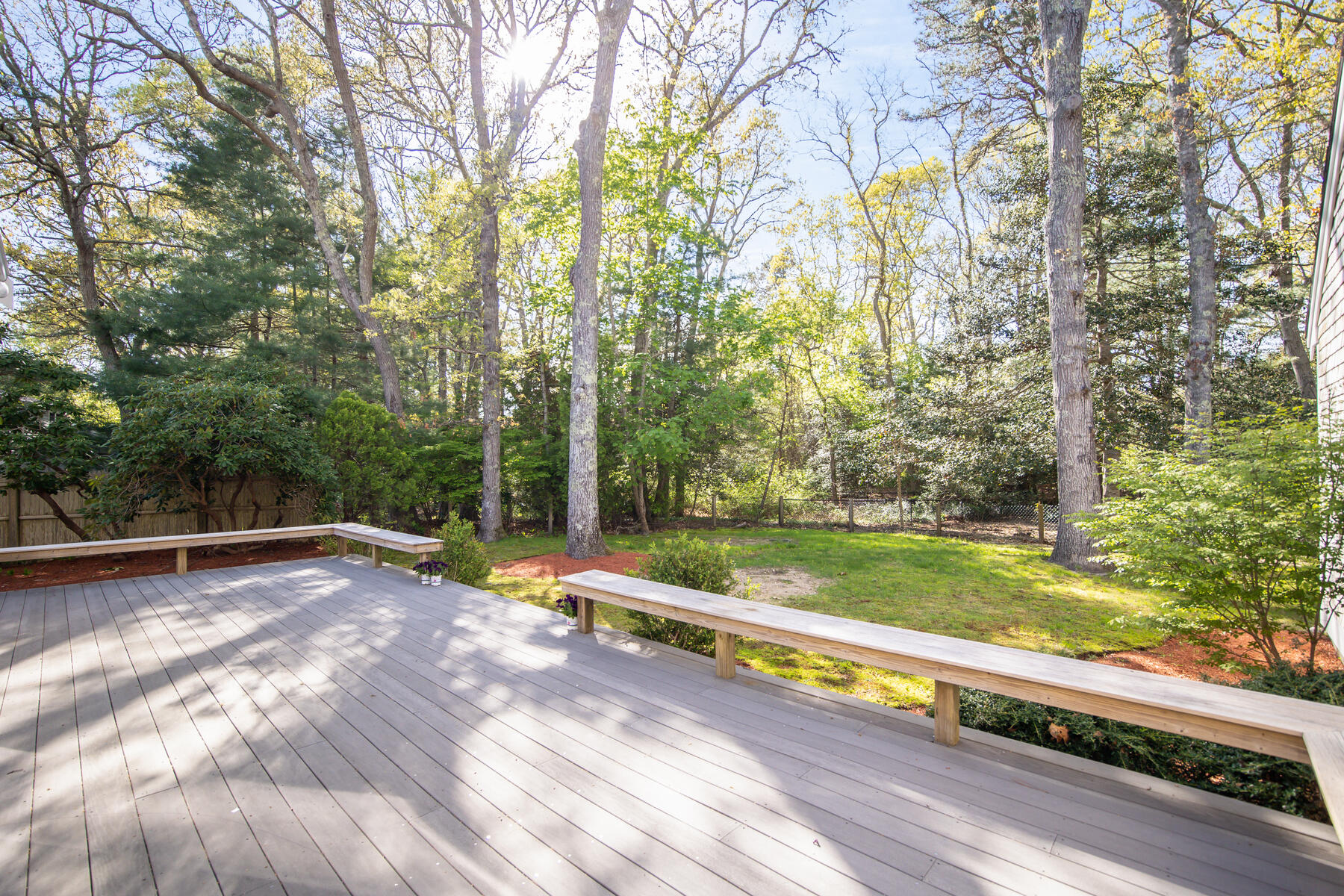 1118 Bumps River Road Centerville, MA 02632 - Photo 16 of 20 a view of a yard with large trees
