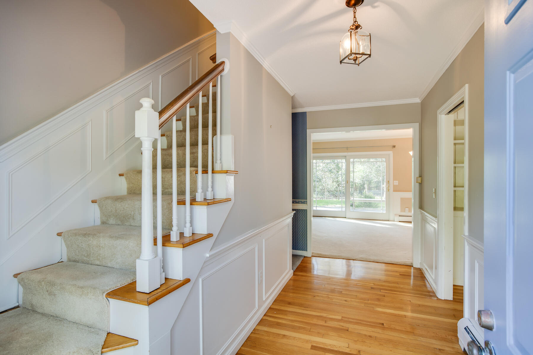 1118 Bumps River Road Centerville, MA 02632 - Photo 3 of 20 a view of an entryway with wooden floor and door