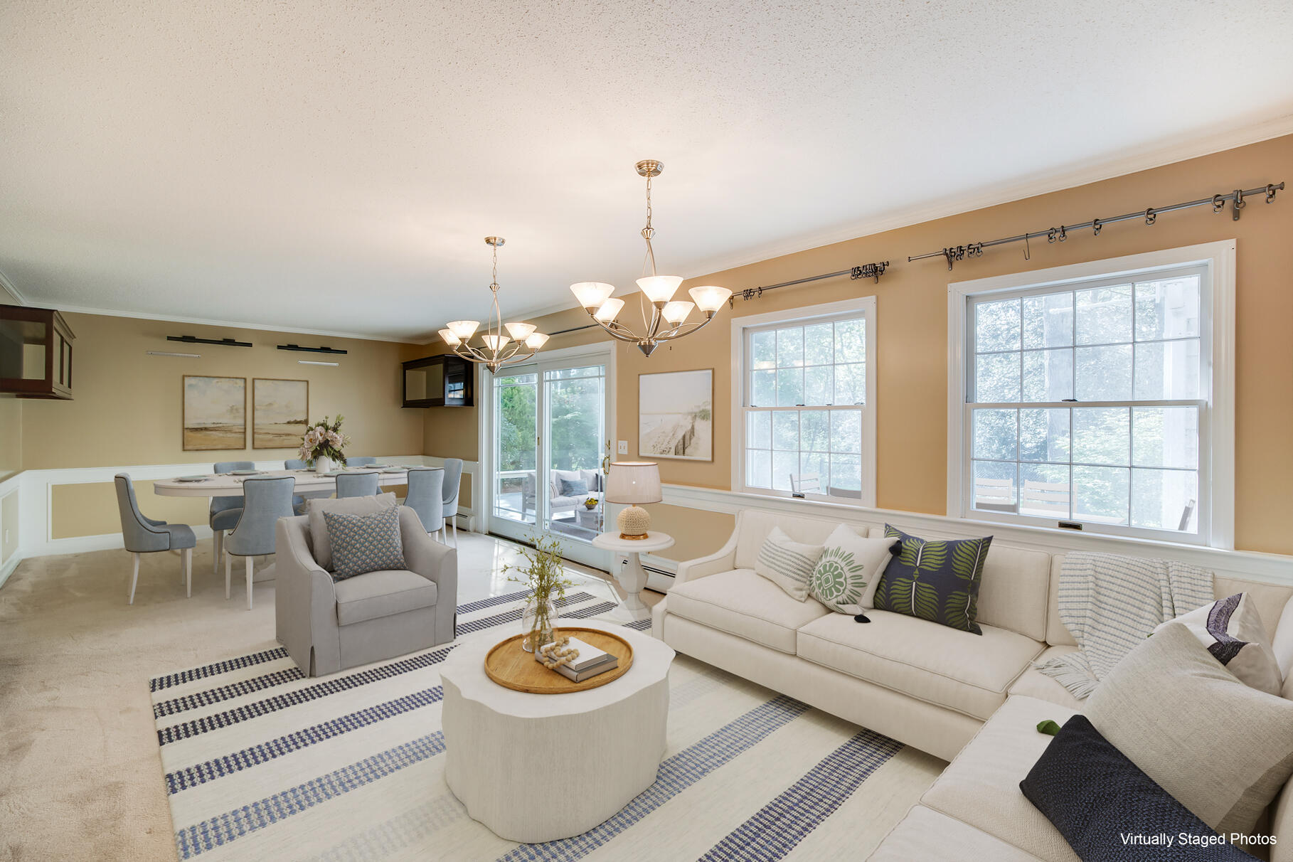1118 Bumps River Road Centerville, MA 02632 - Photo 6 of 20 a living room with furniture a fireplace and a chandelier