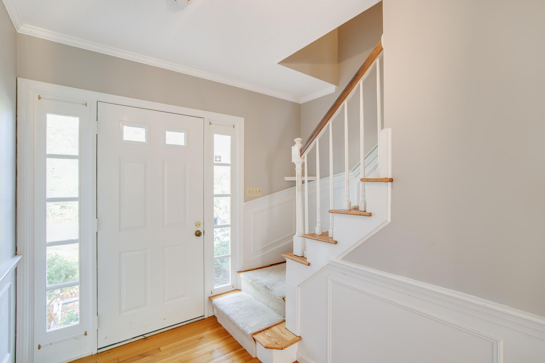 1118 Bumps River Road Centerville, MA 02632 - Photo 7 of 20 a view of an entryway with wooden floor and door