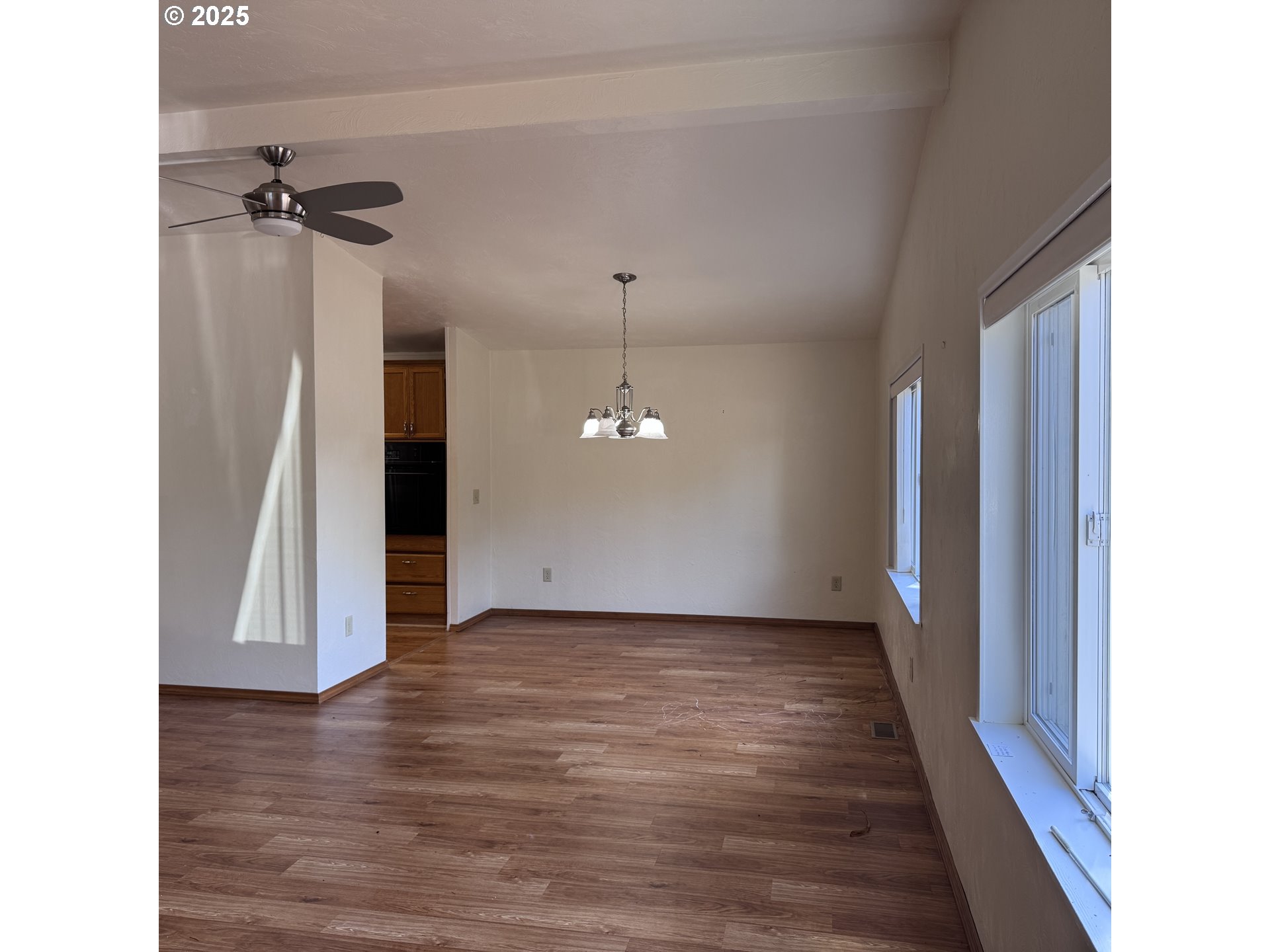 1601 Rhododendron Drive, Unit 695 Florence, OR 97439 - Photo 19 of 42 a view of a hallway with a chandelier