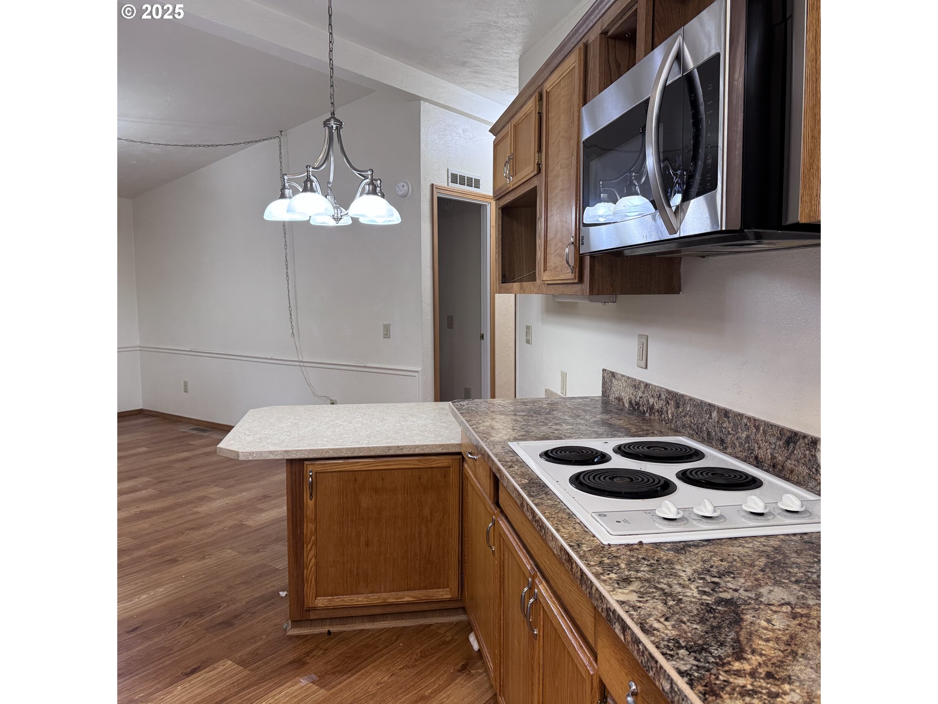 1601 Rhododendron Drive, Unit 695 Florence, OR 97439 - Photo 28 of 42 a kitchen with a sink a stove and cabinets