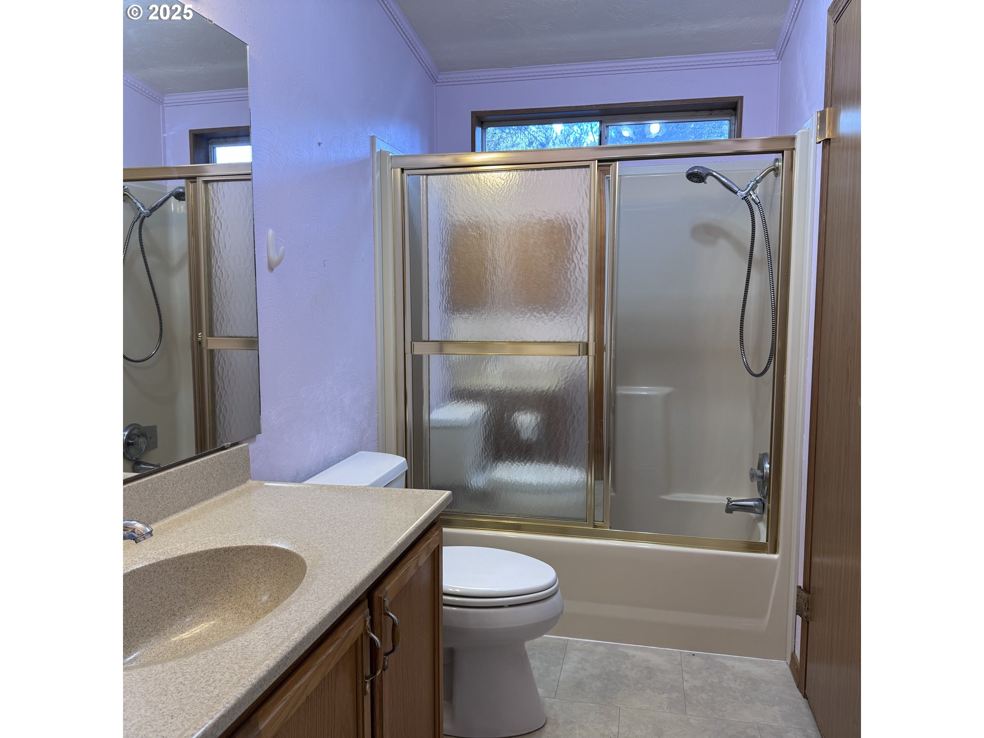 1601 Rhododendron Drive, Unit 695 Florence, OR 97439 - Photo 38 of 42 a bathroom with a granite countertop sink toilet and shower