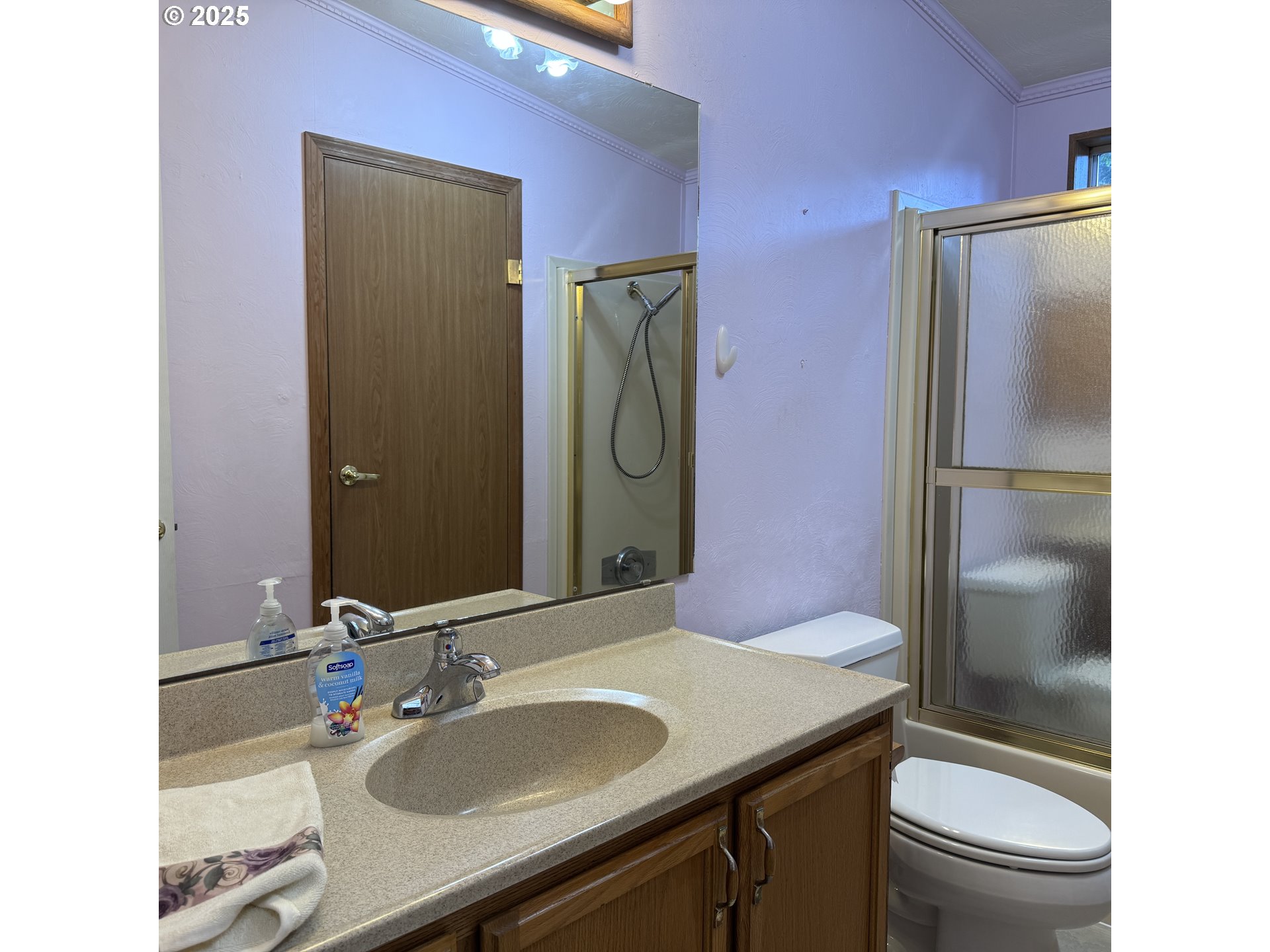 1601 Rhododendron Drive, Unit 695 Florence, OR 97439 - Photo 39 of 42 a bathroom with a granite countertop toilet sink and shower