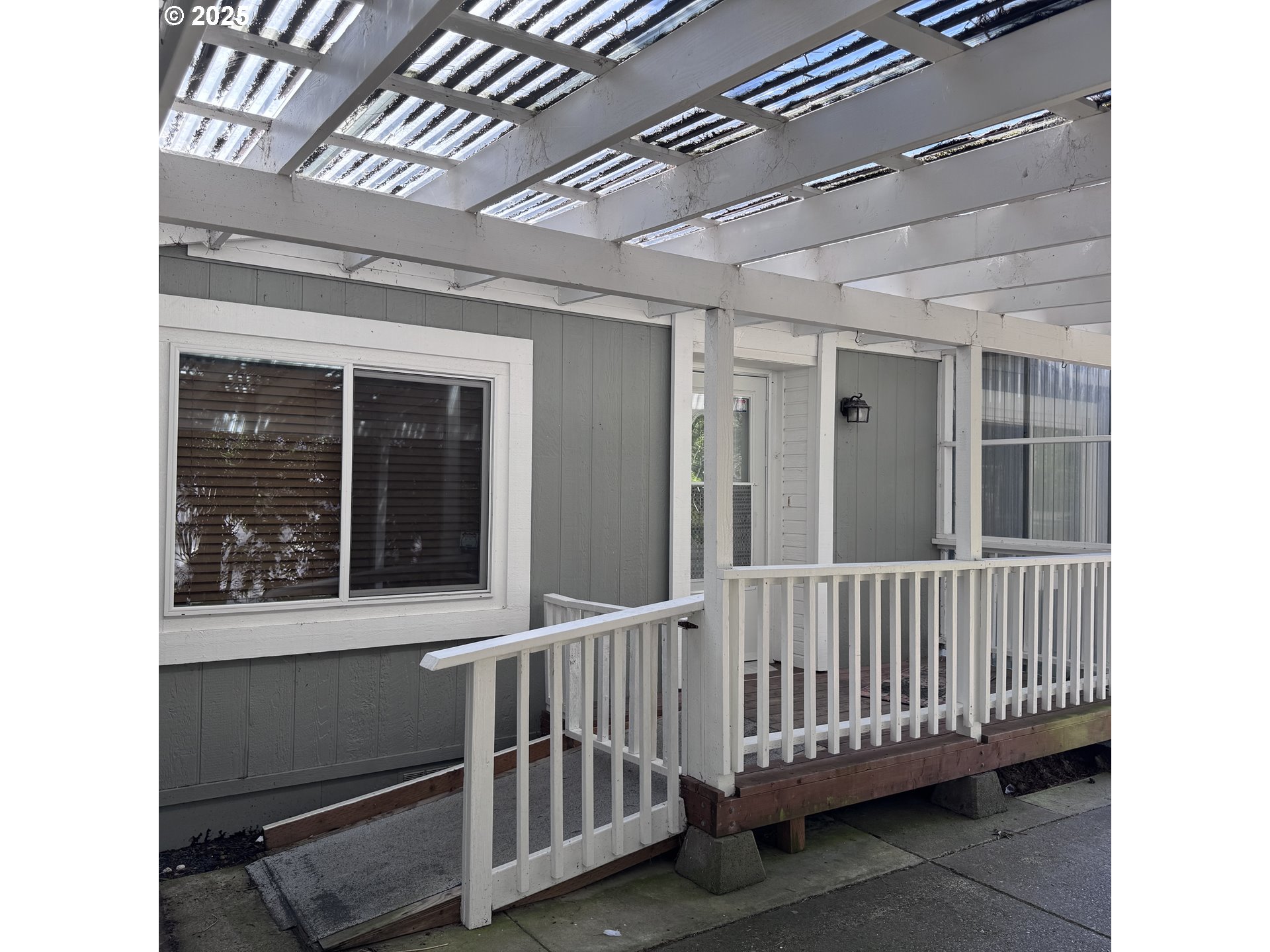 1601 Rhododendron Drive, Unit 695 Florence, OR 97439 - Photo 4 of 42 a view of a porch with a door