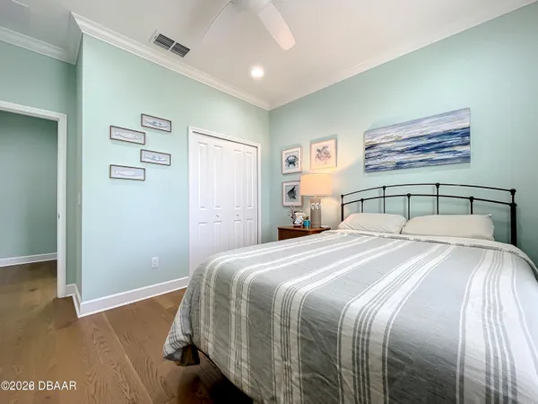a spacious bedroom with a bed and a window