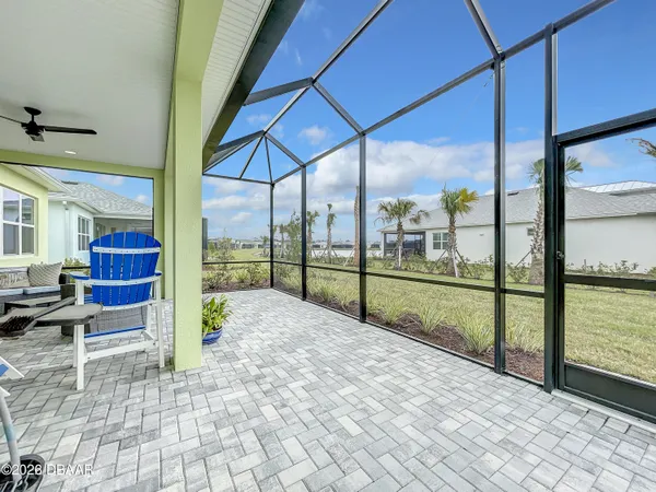 a view of a dinning table and chairs in the patio