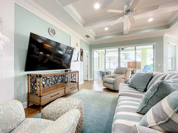 a living room with furniture and a flat screen tv