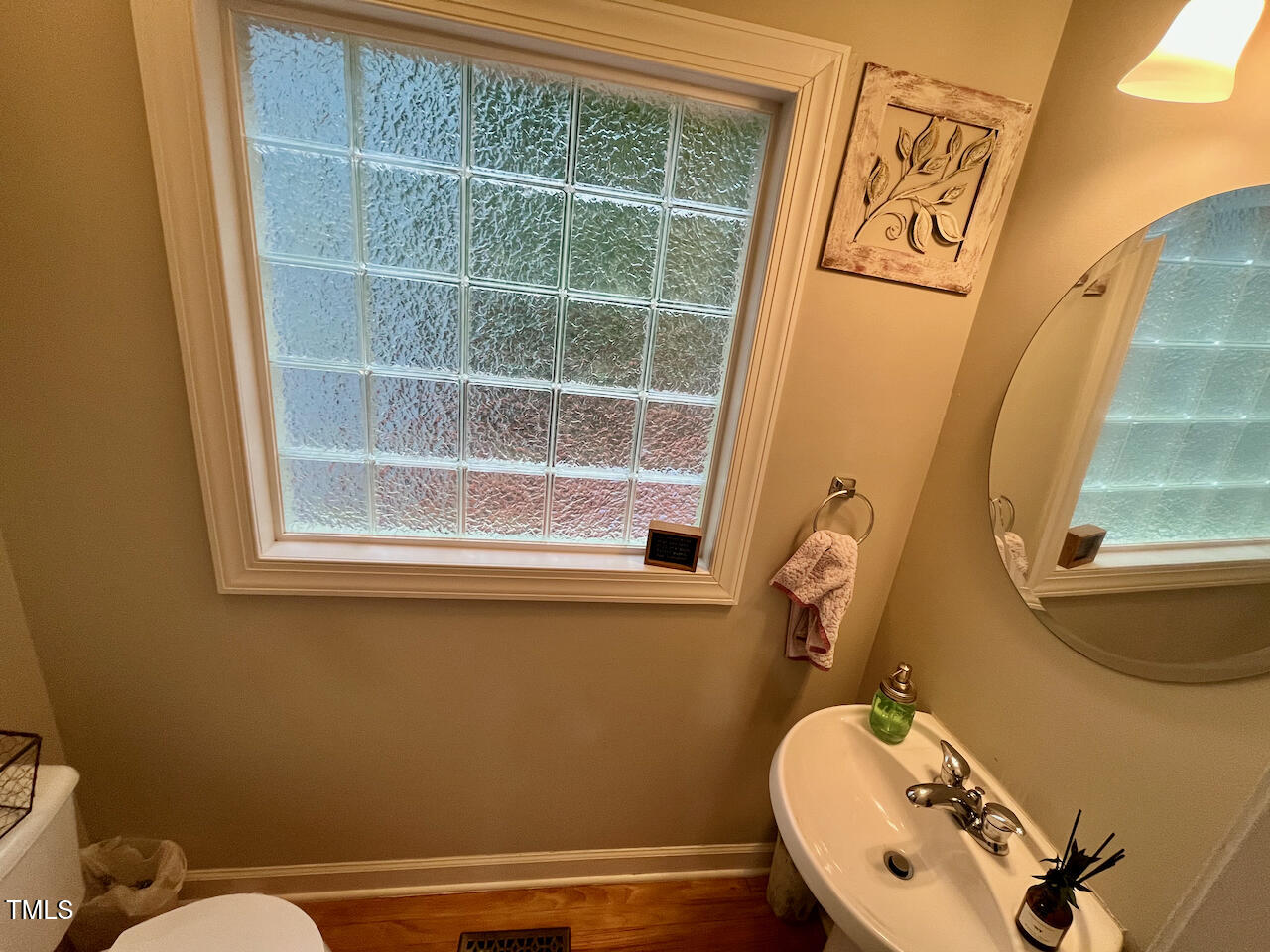 159 Geranium Way Clayton, NC 27527 - Photo 13 of 29 a bathroom with a sink and a mirror