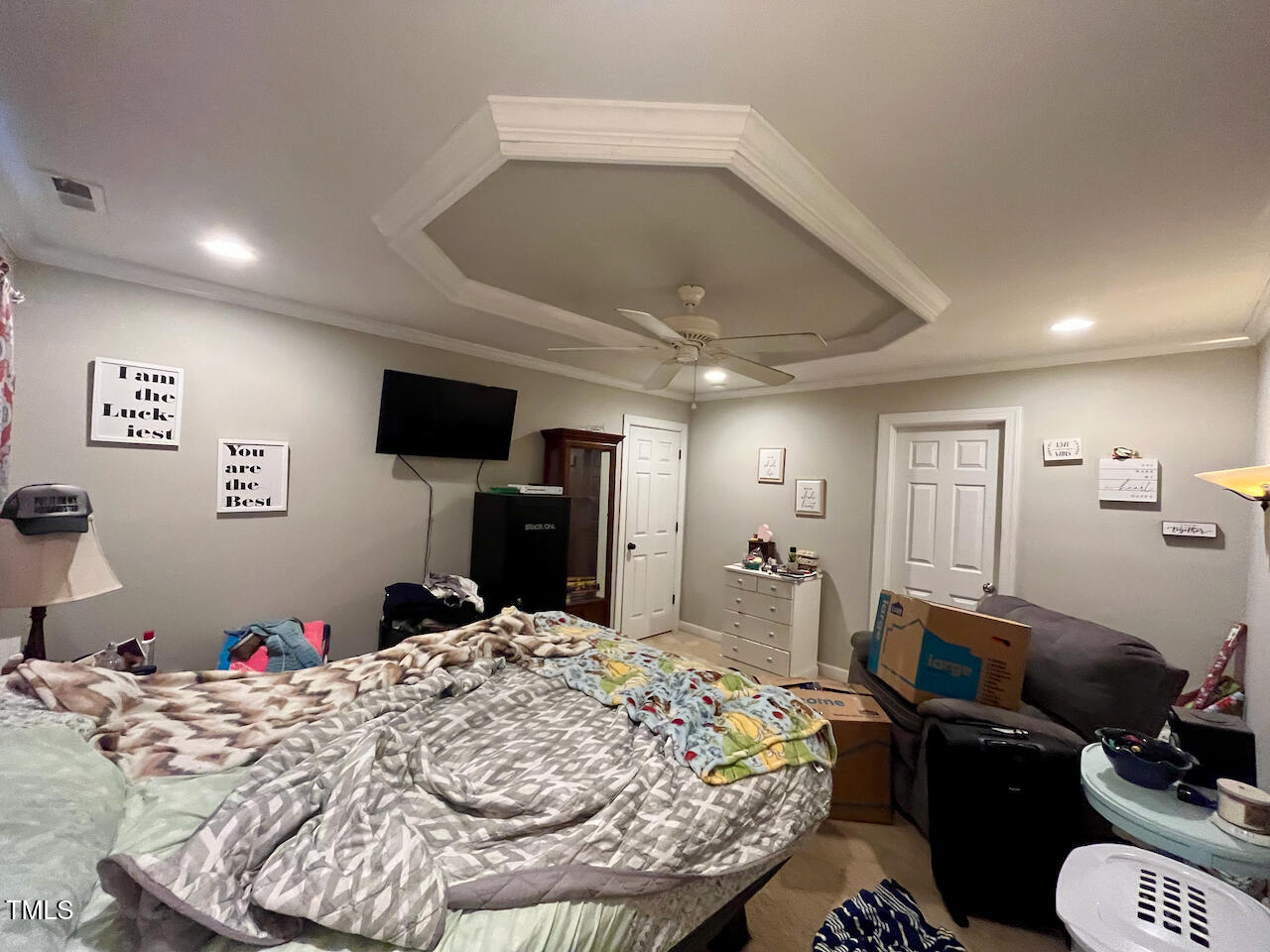 159 Geranium Way Clayton, NC 27527 - Photo 16 of 29 a bed room with a bed and a television