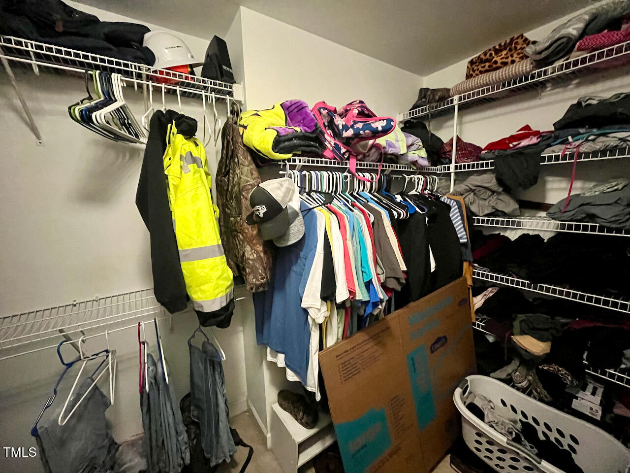159 Geranium Way Clayton, NC 27527 - Photo 18 of 29 a view of walk in closet with clothes and shoes