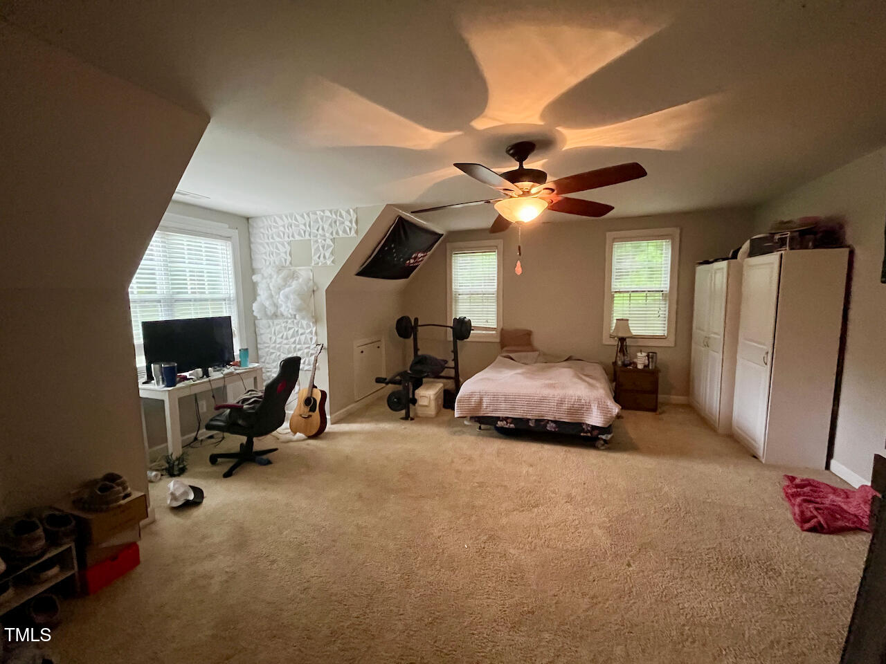 159 Geranium Way Clayton, NC 27527 - Photo 19 of 29 a bedroom with furniture and a chandelier
