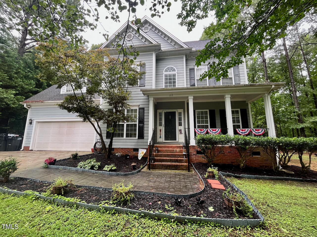 159 Geranium Way Clayton, NC 27527 - Photo 2 of 29 a front view of a house with garden