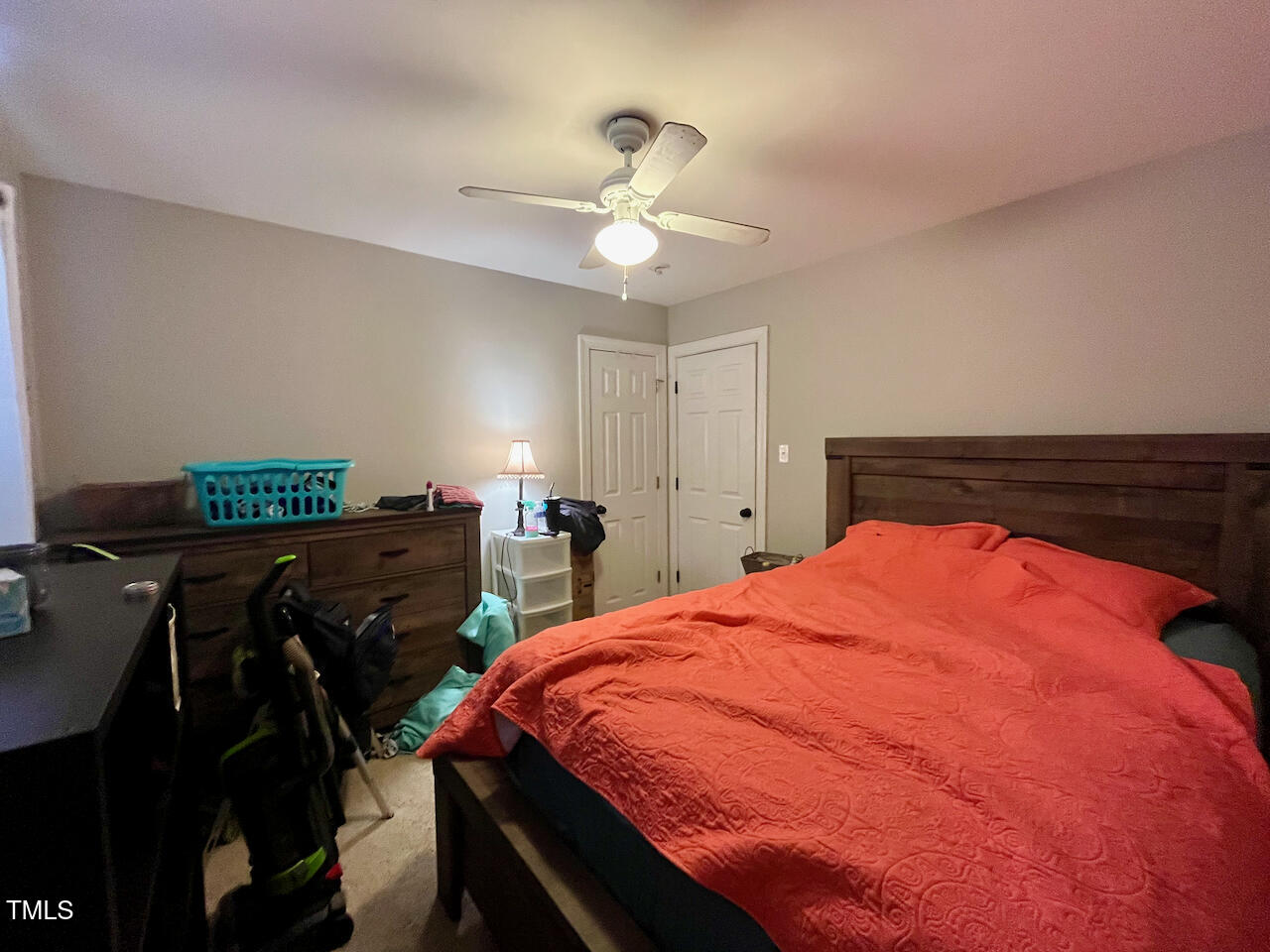 159 Geranium Way Clayton, NC 27527 - Photo 21 of 29 a bed room with a bed and a chandelier