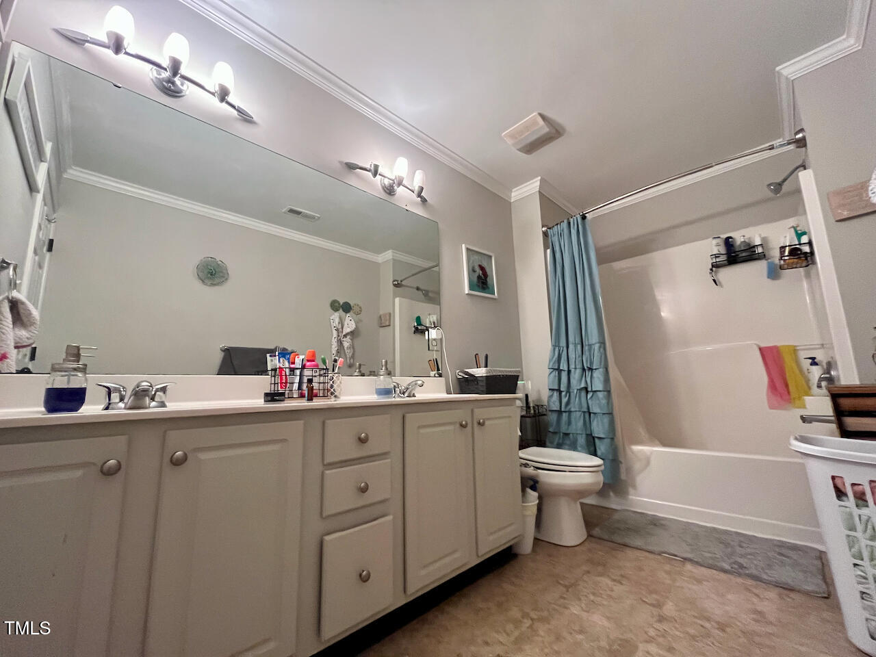 159 Geranium Way Clayton, NC 27527 - Photo 22 of 29 a bathroom with a sink vanity mirror and toilet
