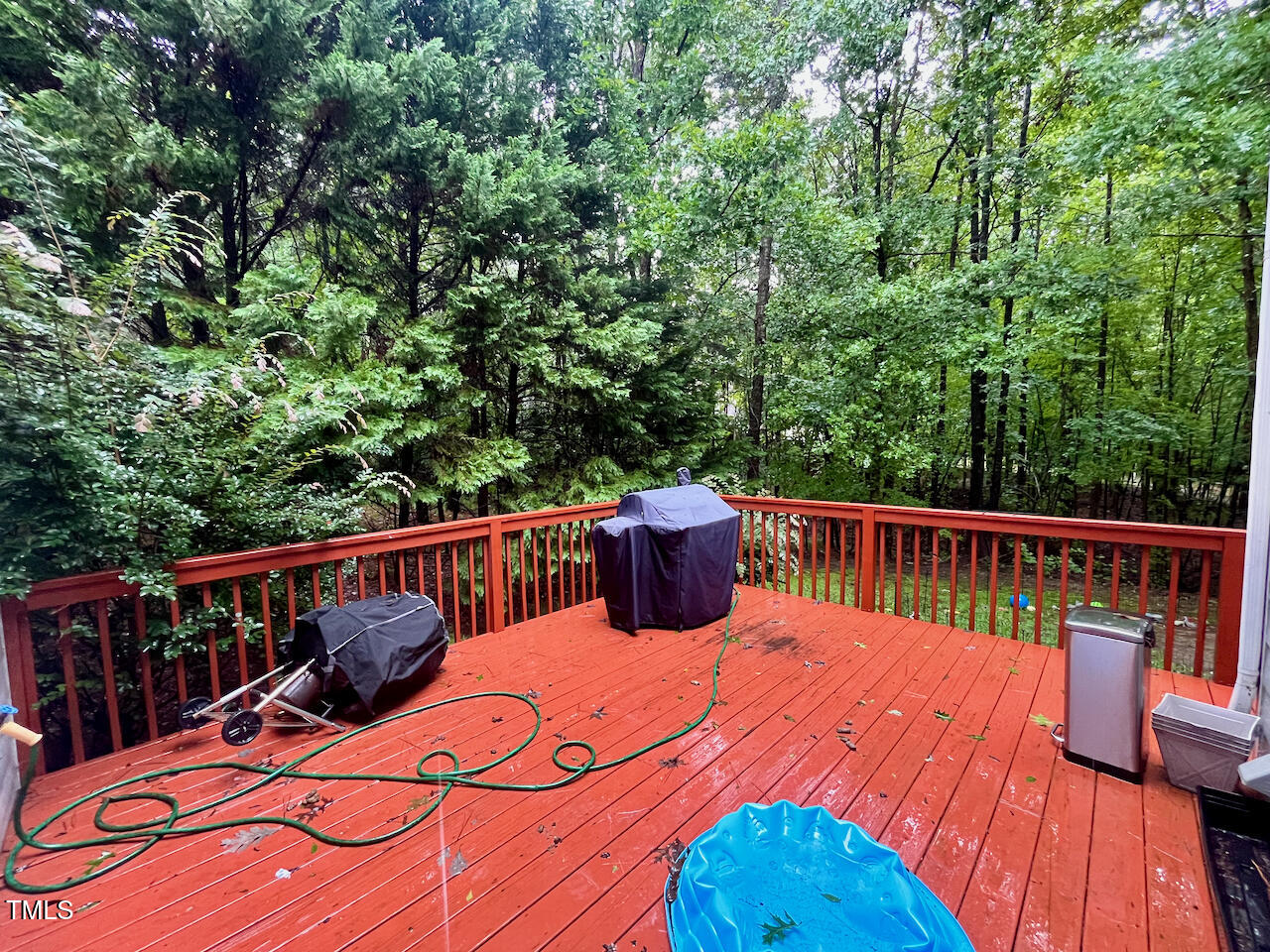 159 Geranium Way Clayton, NC 27527 - Photo 26 of 29 a balcony with wooden floor and fence