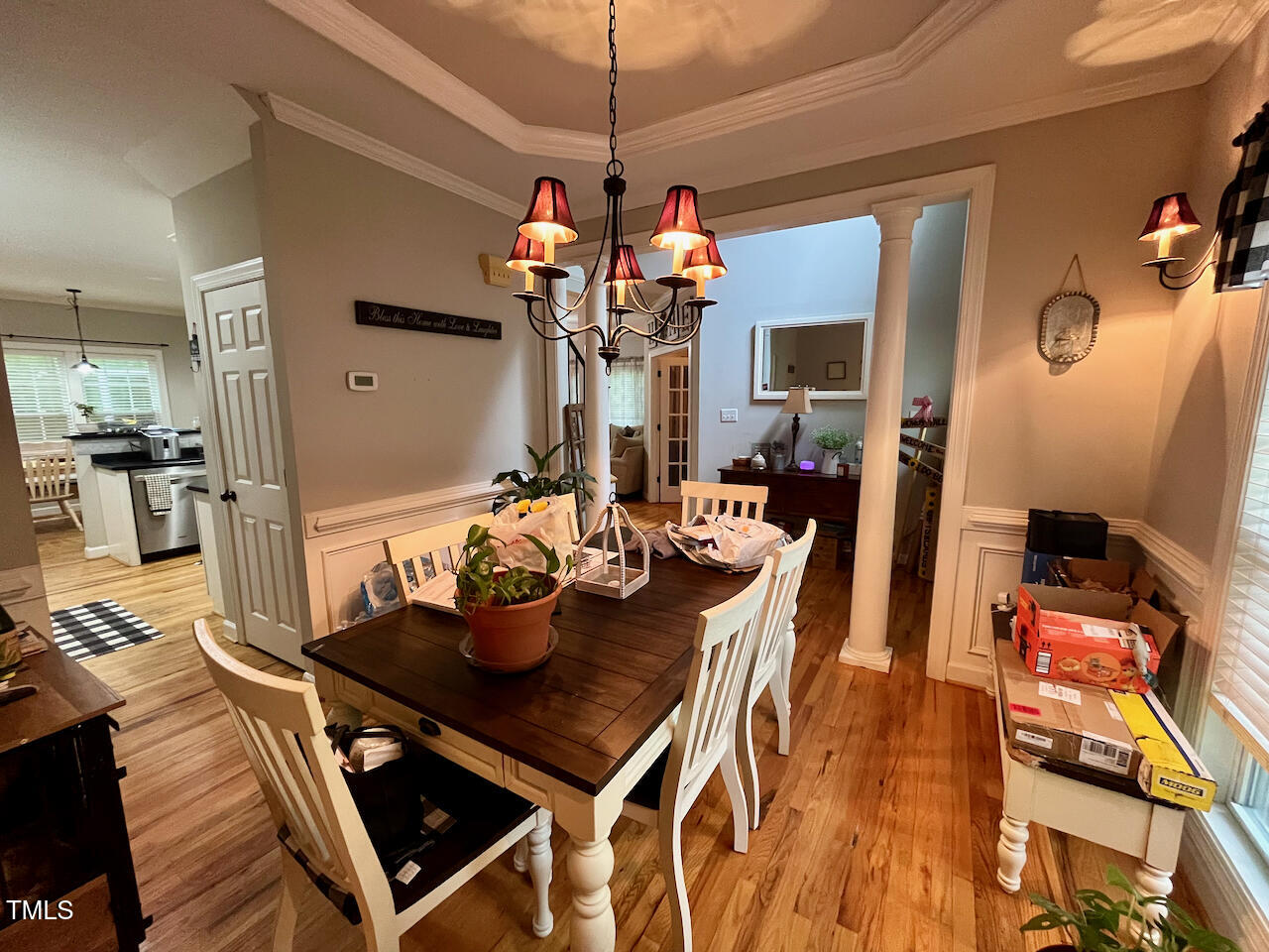 159 Geranium Way Clayton, NC 27527 - Photo 4 of 29 a view of a dining room with furniture and a chandelier