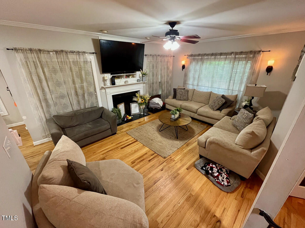 159 Geranium Way Clayton, NC 27527 - Photo 10 of 29 a living room with furniture and a flat screen tv