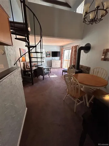 a view of a hallway with furniture