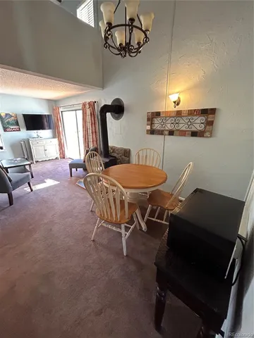 a kitchen with stainless steel appliances granite countertop a refrigerator and a stove