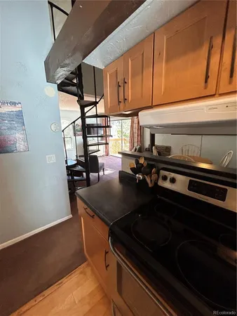 a kitchen with counter top space cabinets and stainless steel appliances