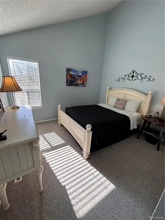 a bedroom with furniture and a couch