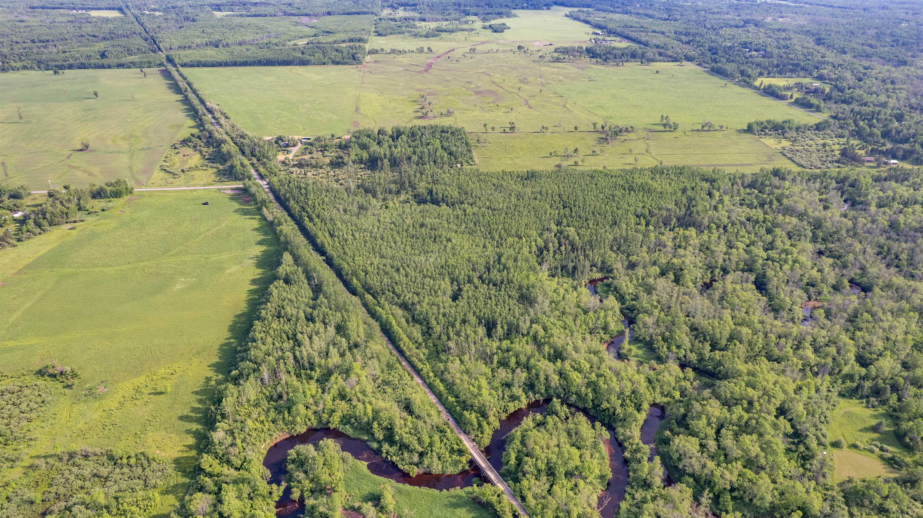 View of rural area featuring a heavily wooded area