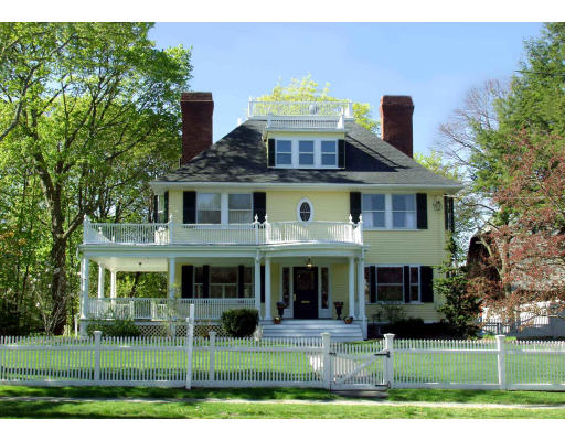 a front view of a residential apartment building with a yard