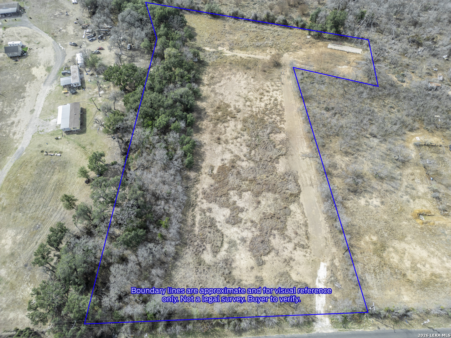 14119 Wheeler Road Atascosa, TX 78002 - Photo 2 of 5 a view of a yard
