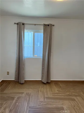 a view of an empty room and window